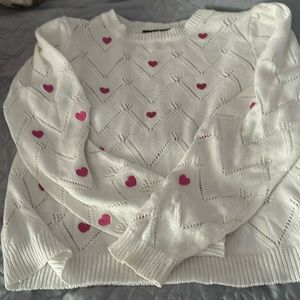 White patterned sweater with hearts